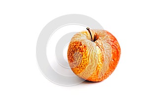 Old apple on a white background