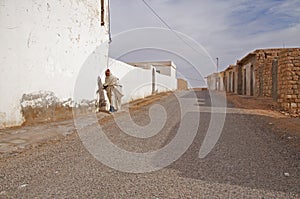 Old arab man walking