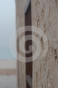 Old Arabian house wall window bye the sea