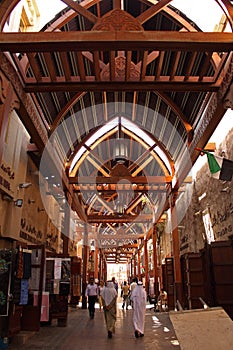 Old arabic souq and people walking in dubai