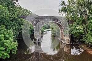 Old arched bridge over the River Torridge at Great Torrington, North Devon. photo