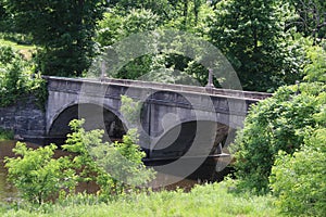 Old arched span bridge countryside river