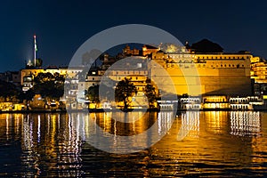 Old architecture historical buildings at the banks of lake at night