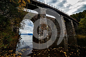 Old archy stone bridge at Transsiberian railway at Baikal lake in autumn