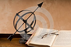 Old Armillary and book.