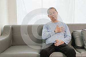 An old Asian man with chest pain was suffering from a heart attack, having difficulty breathing