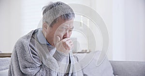 Old asian man get a cold