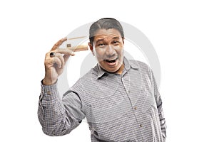 old asian man holding credit card showing it happily white background