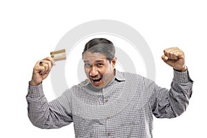 old asian man holding credit card with shrugging shoulders fist pump gesture