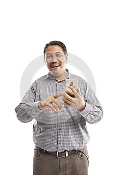 old asian man holding handphone with smiling face in white background