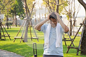 Old Asian people suffer from exercise pain. senior man suffering from headache