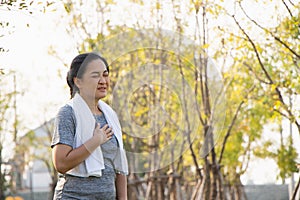 Old Asian people suffer from exercise pain. Senior woman having heart attack