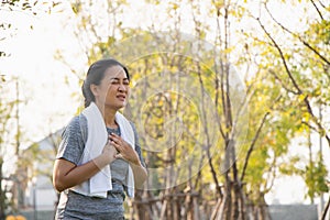 Old Asian people suffer from exercise pain. Senior woman having heart attack