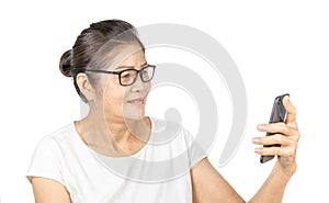 Old asian woman using smart phone for social media lifestyle