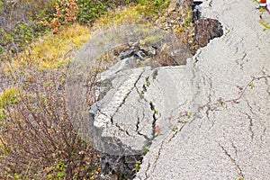 Old asphalt road in landslide