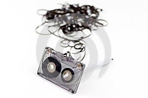 Old audio cassette with loose tape