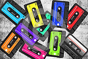 Old audio cassette. Multicolored audio tapes. Close-up view. The concept of old music. large collection of retro cassette tapes.