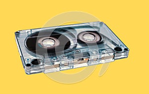 old audio cassette tape on yellow background