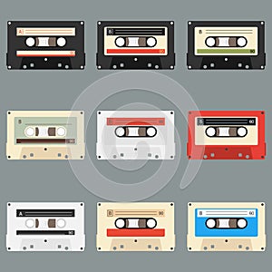 Old audio cassettes gray background. Collection of vector retro audio cassettes. Set of different colorful music tapes.