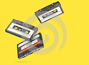 Old audio tape compact cassette isolated on yellow background