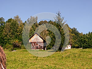 Old authentic wood house hayloft Carpathian mountains Ukraine Europe. Local countryside travel hiking trails Cottagecore