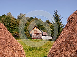 Old authentic wood house hayloft Carpathian mountains Ukraine Europe. Local countryside travel hiking trails Cottagecore