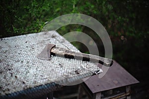 Old ax on the rural table with bubble wrap