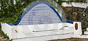 Old azulejo tiles on water fountain