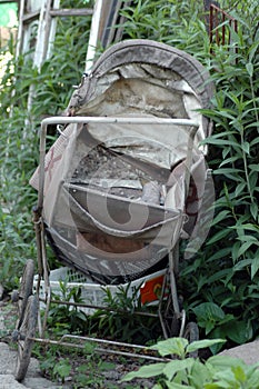 Old baby carriage in the garden