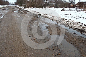 Old bad asphalt road with pits