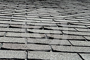 Old Bad and Curling Roof Shingles on a House or Home