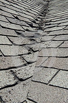 Old Bad and Curling Roof Shingles on a House or Home