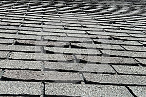 Old Bad and Curling Roof Shingles on a House or Home photo