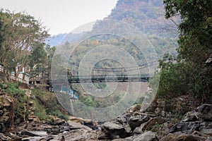Old bailey bridge over rocky mountain river valley photo