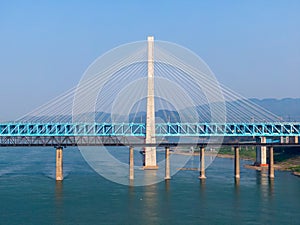 Bird view of Old and New Baishatuo Yangtze River Railway Bridge under blue sky photo