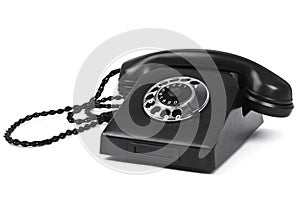 Old bakelite telephone on white