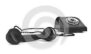 Old bakelite telephone on white