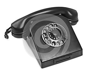 Old bakelite telephone on white