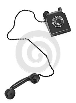 Old bakelite telephone on white