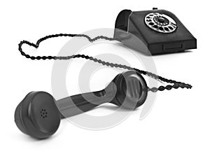 Old bakelite telephone on white