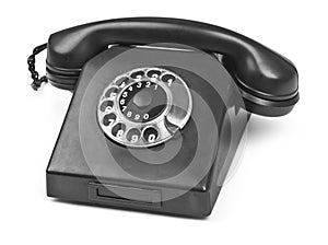 Old bakelite telephone on white