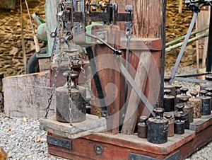 Old balance levers with weights. Vintage wooden and metal scales with set og weights