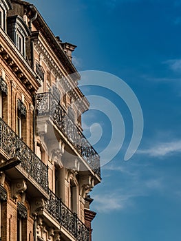 Old balconys and cloudy sky in Toulouse France photo