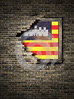 Old Baleares Islands flag in brick wall