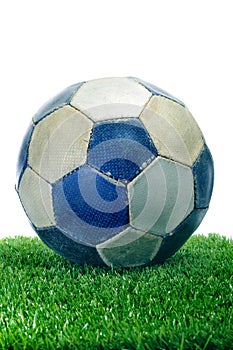 Old ball on the grass