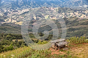 Old bamboo house on top of the hills mountain background