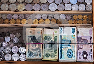 Old banknotes and coins photo