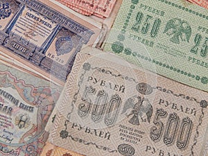 Old banknotes of the Russian Empire as a background.