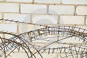 Old barbed wire against wall of the house