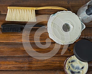 OLD BARBER TOOLS ON WOODEN BACKGROUND